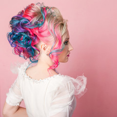 Cool young woman with colored hair. Stylish hairstyle, informal style.
