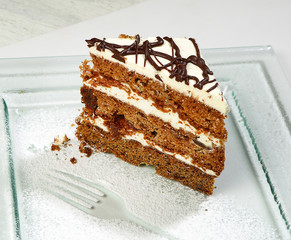Dessert - A piece of cake, a biscuit and cream, close-up