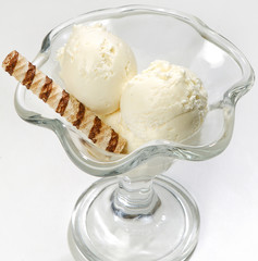 ice cream in a glass vase on a white background, close-up