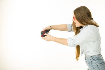 Profile view of woman playing video games