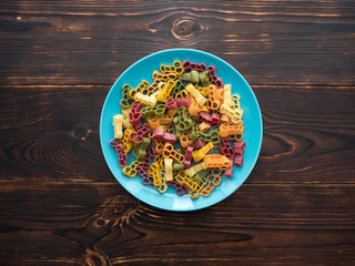 Italian multicolored paste of unusual shape on a plate