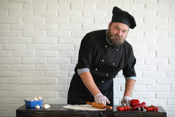 Bearded chef chef prepares meals