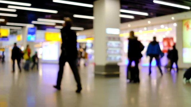 Defocused video of people walking to the departure hall in airport