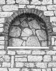 arched frame on stone wall, Black and White