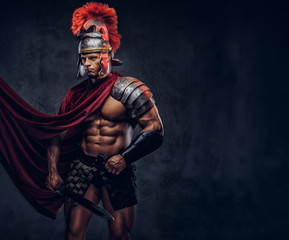 Fototapeta na wymiar Portrait of a brutal Roman legionary in battle uniforms