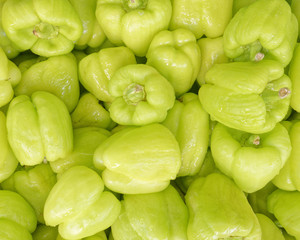 organic green peppers top view, food background