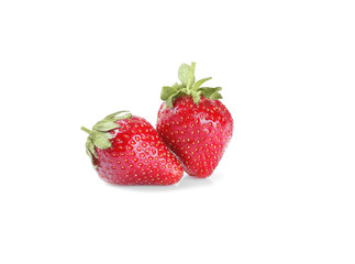 Two strawberries close up on white background