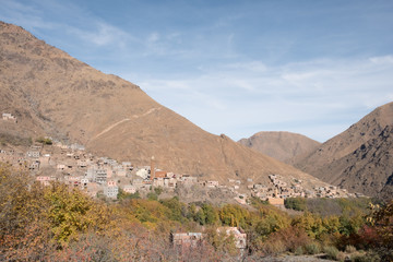Morocco, Imlil: photo of old town in sandy mountains in hot summer with blue sky