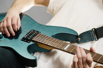 Fototapeta premium Close up of man playing on electric guitar