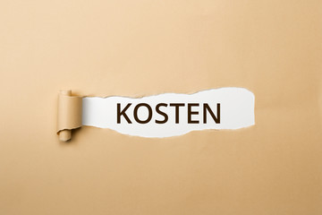 KOSTEN Schriftzug - aufgerissenes Papier