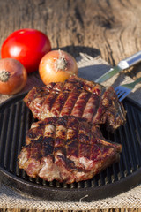 Steak on the grill. Fried meat. Fille on the frying pan
