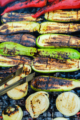 Grilled vegetables in marinade on a grill pan, top view