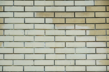 Brick wall texture of yellow stone blocks closeup abstract background