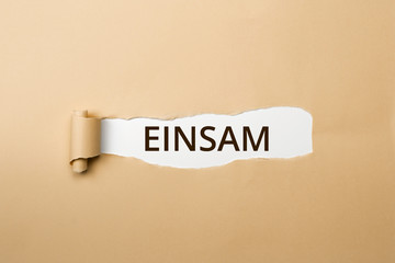 EINSAM Schriftzug - aufgerissenes Papier