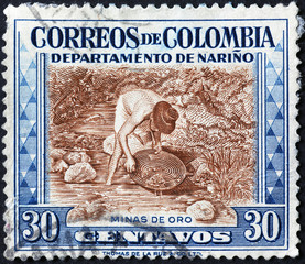 Gold miner on old colombian postage stamp