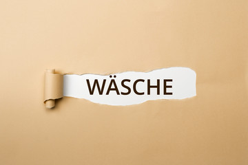 WÄSCHE Schriftzug - aufgerissenes Papier