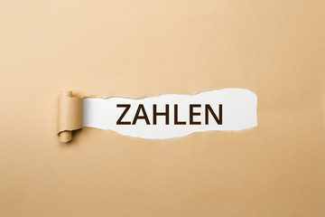 ZAHLEN Schriftzug - aufgerissenes Papier