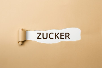 ZUCKER Schriftzug - aufgerissenes Papier