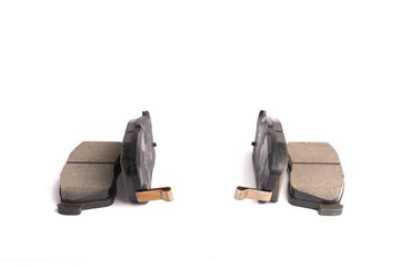 Set of 4 pieces of new front disc brake pads, isolated on white