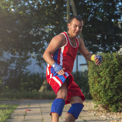 athlete performs gymnastic running exercises for outdoor sports training.