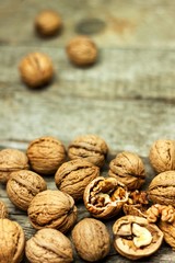 Walnuts on an old wooden board. Healthy food. Autumn harvest.