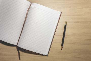 notebook on the wooden table