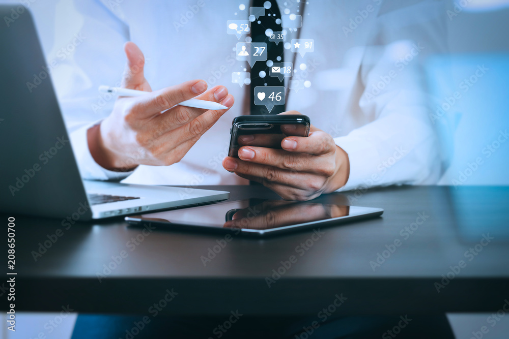 Poster close up of businessman working with smart phone on wooden desk in modern office with virtual icon d