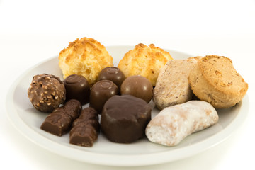 Polvorones typical spansih and chocolate sweets on white background