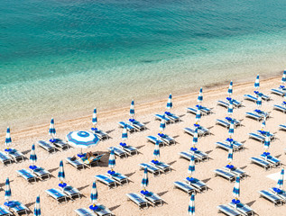 Panoramic view of  beach with blue umbrellas and turquoise sea. Mediterranean sea