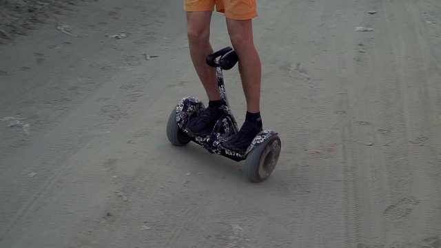 Gyroboard. A man is riding a gyroboard