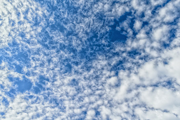 Cumulus clouds on deep blue sky