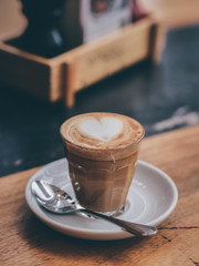coffee latte on the wood desk in cafe