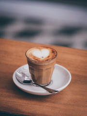 coffee latte on the wood desk in cafe