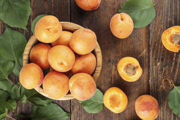 Naklejka na ściany i meble Ripe apricots in a plate. Fresh fruits.