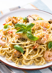 Pasta spaghetti with seafood and cream sauce.