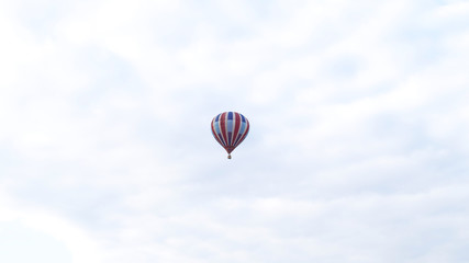 Striped Hot Air Balloon floating in the sky