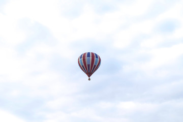 Striped Hot Air Balloon floating in the sky