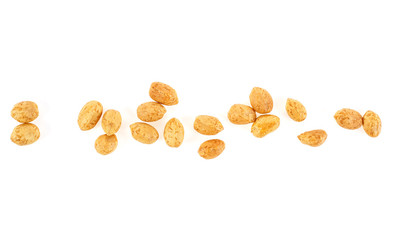 Roasted salted peanuts isolated on a white background, top view.