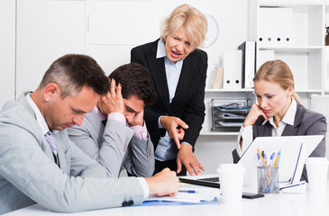 Fototapeta premium Female manager expressing dissatisfaction with teamwork