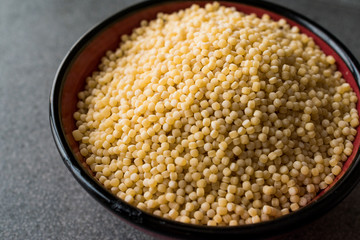 Raw Dry Organic Couscous in a Bowl
