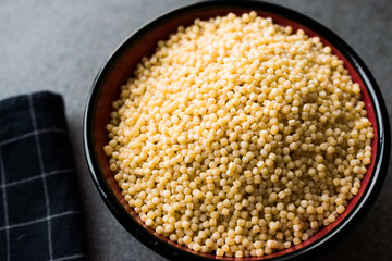 Raw Dry Organic Couscous in a Bowl