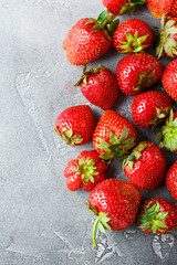 Fresh strawberry on concrete board.