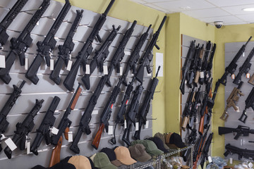 air-powered rifle   hangs on the wall in  army store