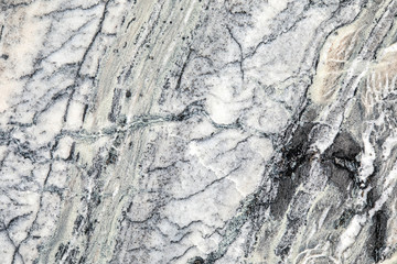 Granite, basalt or marble stone crystal texture of polished gravestone. The macro shot is made by means of stacking technology