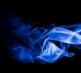 Fototapeta premium Blue smoke on black background