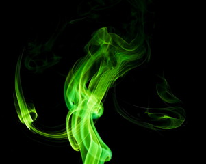 Green smoke on black background