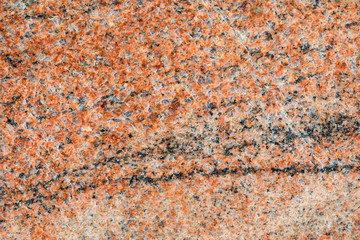 Granite, basalt or marble stone crystal texture of polished gravestone. The macro shot is made by means of stacking technology