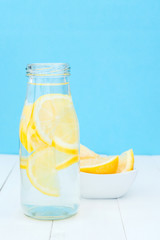 Front view of glass bottle with a detox lemon water