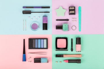 set of professional decorative cosmetics, makeup tools and accessory on multicolored background. beauty, fashion, party and shopping concept. flat lay composition, top view