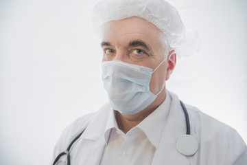 Fototapeta premium doctor in medical mask close-up, male 